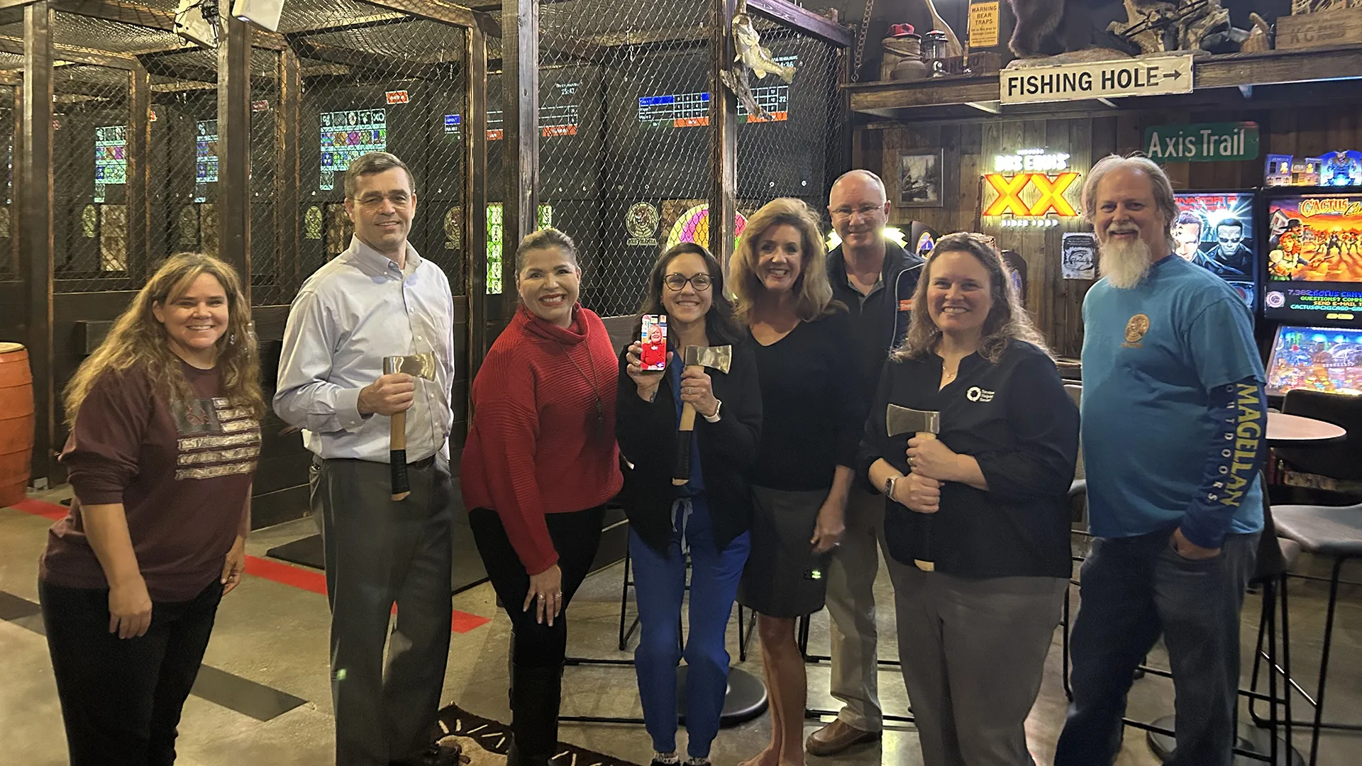 group celebrating a birthday party at Axe-Mania in Kingwood